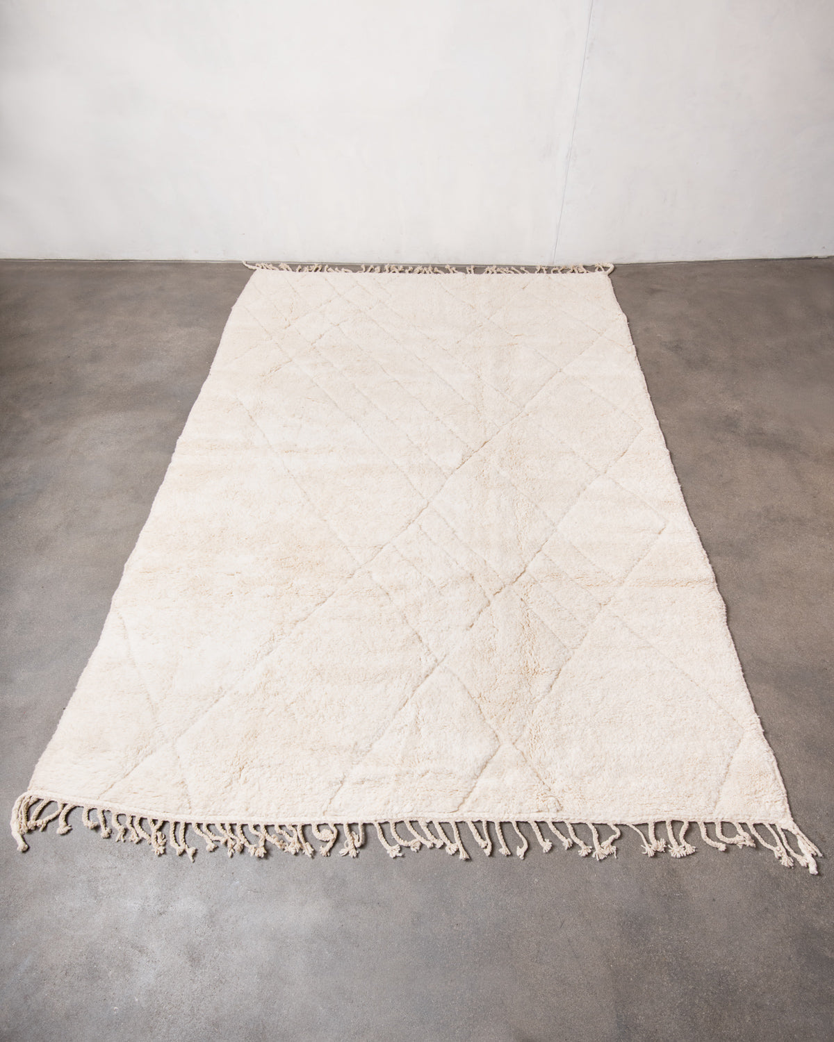 Modern, designer, handcrafted Berber rug from Morocco. Beniourain carpet with minimalist design, natural wool pile and a fluffy texture.